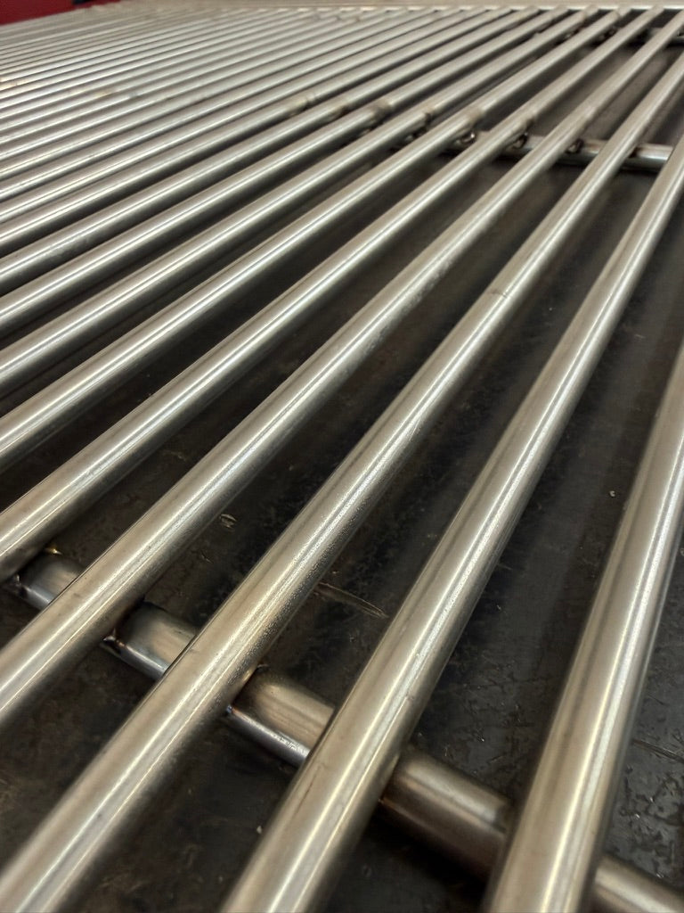 Custom-fit stainless steel round bar cook grate set for a Legacy offset smoker